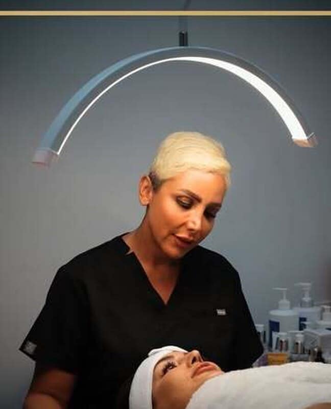 A client receiving a scalp and facial treatment at Muchin Beauty Clinic